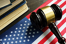 Clickable photo of law book, amercan flag, and gavel. Links to court rules.